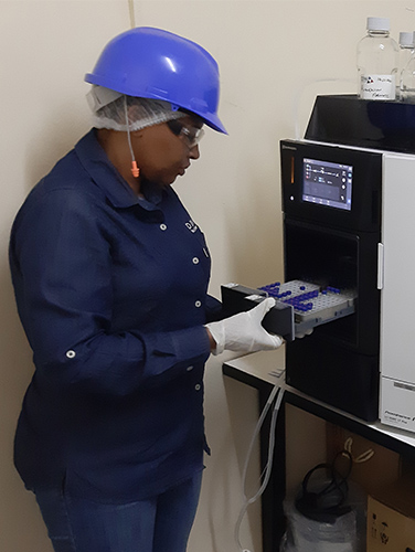 DDW Associate conducting caramel color quality check in Matsapha eSwatini